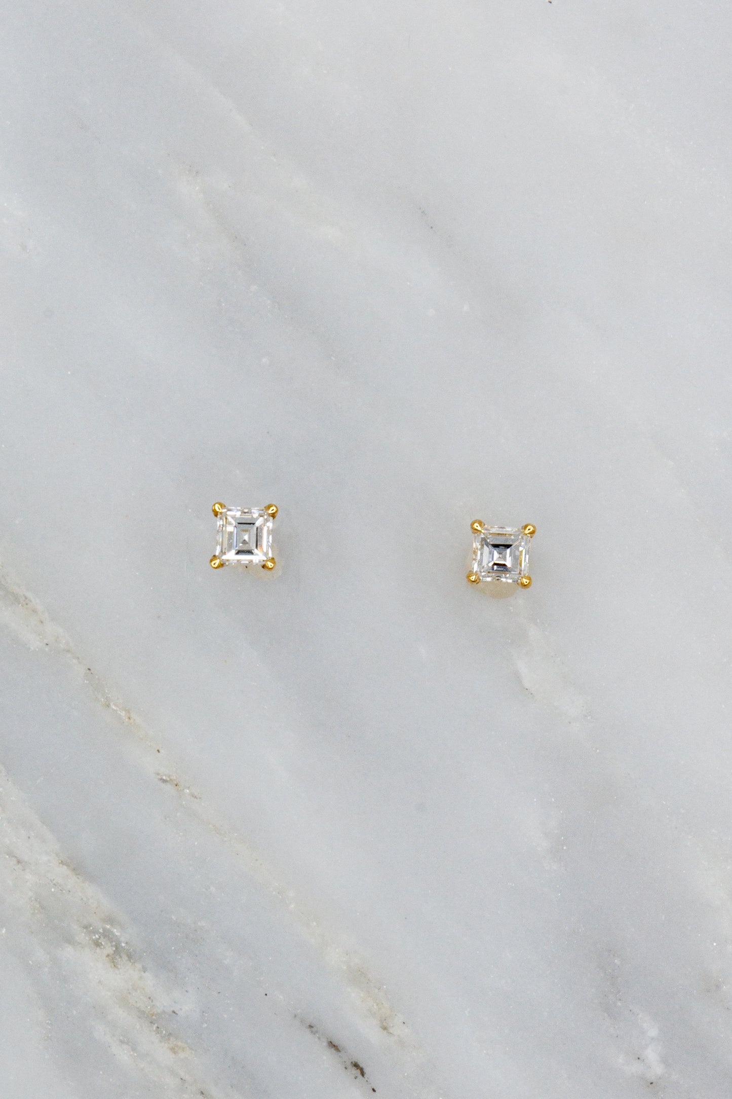 0.4 carat carre-cut diamond studs set in 18k yellow gold