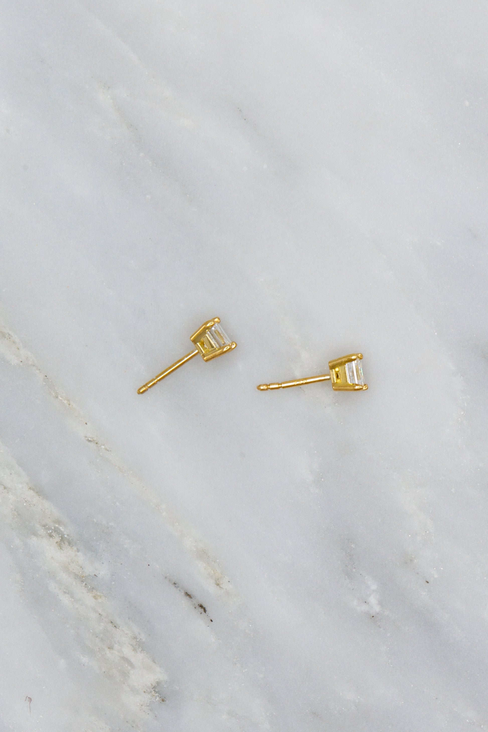 0.4 carat carre-cut diamond studs set in 18k yellow gold